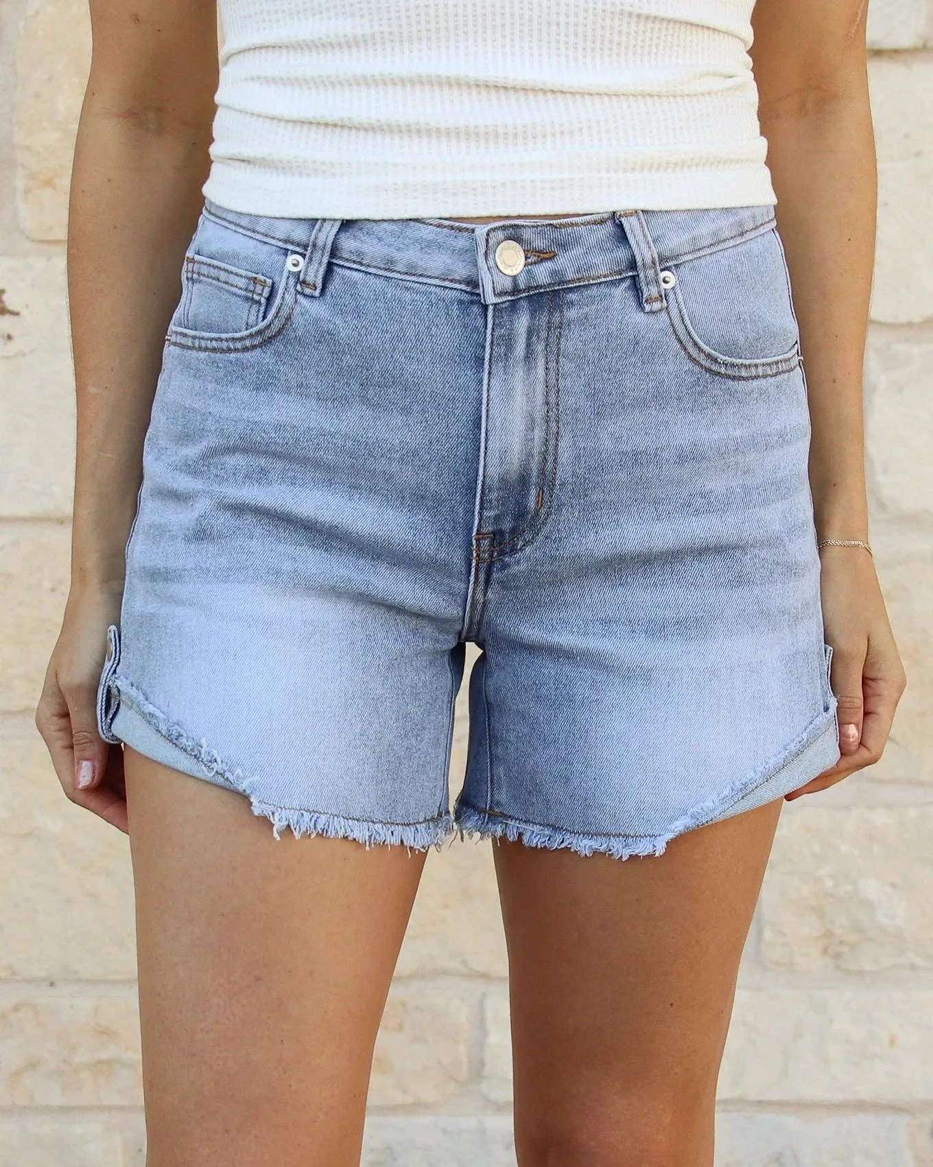 Grace and Lace Drop Hem Denim Shorts in Light Mid-Wash