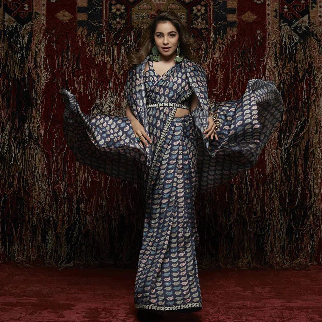 KAIRI PRINT SAREE PAIRED WITH PRINTED TIE UP BUSTIER AND PRINTED CAPE AND EMBROIDERED BELT