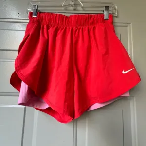 Nike Dri Fit Women’s running Orange shorts Size Medium